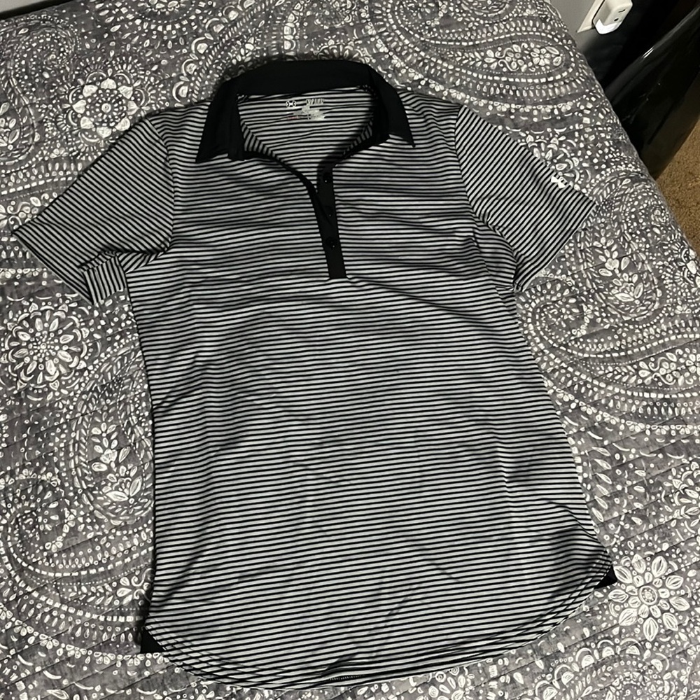 Under Armour golf polo. Moisture wicking material.